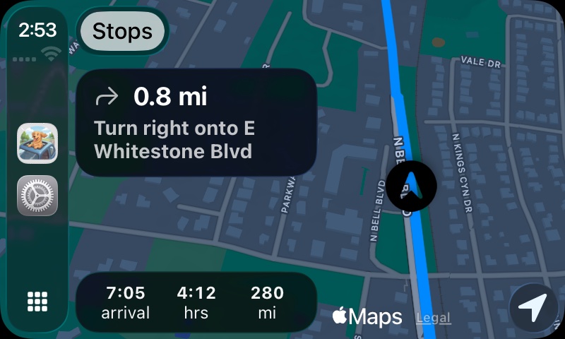 Road Trippin' Buddy on Apple CarPlay at night: map with route line, 0.8 mile turn card, and arrival time, hours and miles remaining